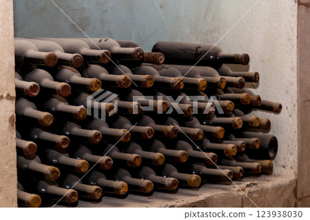Old bottles of wine stacked in rows Old bottles of wine stacked in rows 123938030