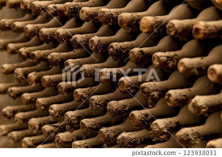 Old bottles of wine stacked in rows Old bottles of wine stacked in rows 123938031