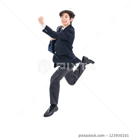 A male student in uniform jumping. A transparent full-body photo PNG precisely cut by hand 123938101