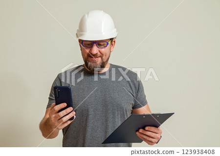 The guy shows talking on the phone The guy shows talking on the phone 123938408