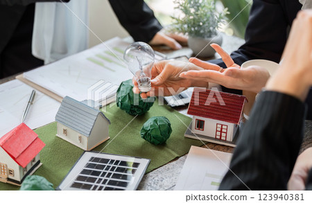 Eco-Friendly Solutions and Collaboration. Presenting renewable energy options with a focus on sustainable houses. 123940381