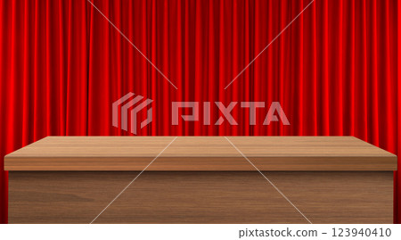 An empty wooden table with a red curtain as a background. 123940410
