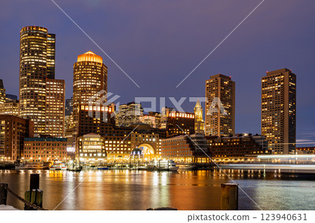 View of Boston downtown  skyscrapers seen from Fan Pier Park on a cold cloudy winter night 123940631