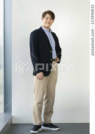A man in his 30s smiling at the camera A man in his 30s smiling at the camera 123940632