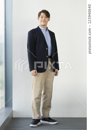A man in his 30s smiling at the camera A man in his 30s smiling at the camera 123940640