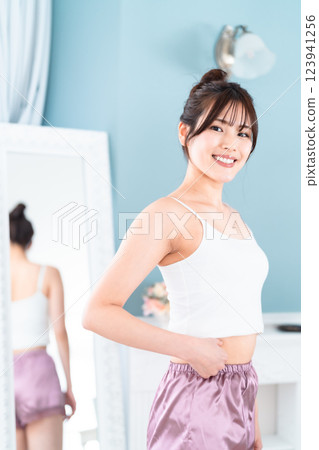 Slim woman working on improving her health Slim woman working on improving her health 123941256