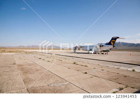 Airplane on landing strip at Olgii airport, Mongolia. Ulgii town 123941453