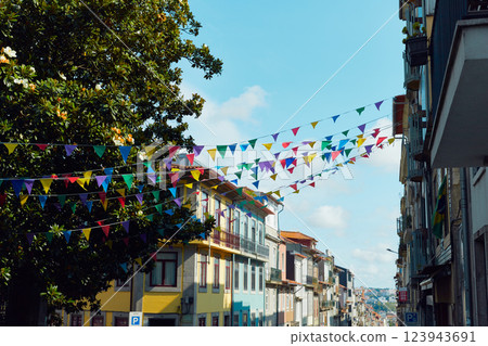 Festive bunting and lanterns decorate a narrow street for summer festival in June San Juan Festive bunting and lanterns decorate a narrow street for summer festival in June San Juan 123943691