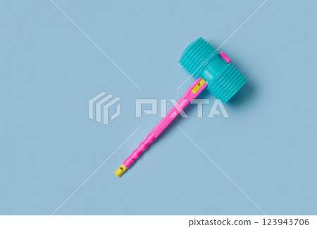 Toy hammer on a blue background for summer festival in June San Juan, Portugal 123943706