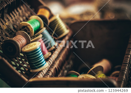 Colorful Threads in a Woven Basket Displayed Artfully 123944269