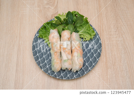 Nems Springrolls on wooden background Nems Springrolls on wooden background 123945477