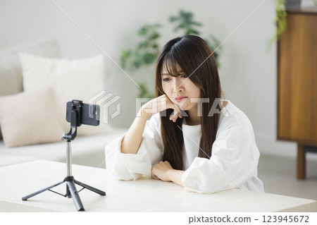 A woman to take with a smartphone 123945672