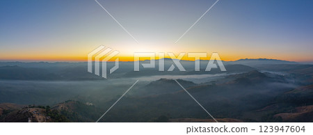 Aerial View of sweet sky in Sunrise in the valley over mist. Aerial View of sweet sky in Sunrise in the valley over mist. 123947604