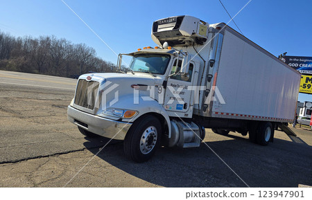 Freight liner Semi-Truck Driving on Open Highway in a Rural Area, CDL Truck showcasing commercial transportation, logistics efficiency, and professional trucking Freight liner Semi-Truck Driving on Open Highway in a Rural Area, CDL Truck showcasing commercial transportation, logistics efficiency, and professional trucking 123947901