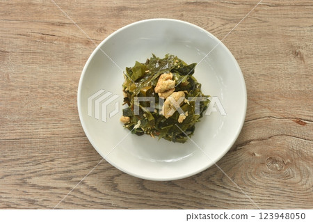 fried Melinjo tropical vegetable with egg on plate fried Melinjo tropical vegetable with egg on plate 123948050