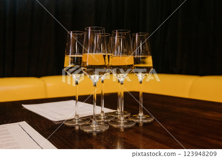 Glasses of champagne on a blur background Glasses of champagne on a blur background 123948209