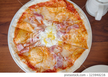 The served dinner table with pizza The served dinner table with pizza 123948216