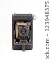 vintage folding camera on white background 123948375