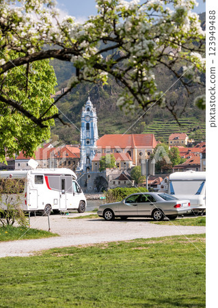 Durnstein village with church against camping area next to the Danube river during spring time in Wachau, Austria Durnstein village with church against camping area next to the Danube river during spring time in Wachau, Austria 123949488