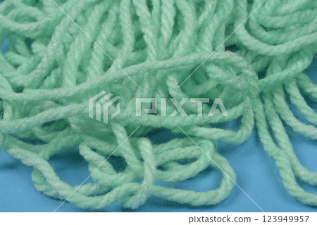 Tangled pile of light green yarn Tangled pile of light green yarn 123949957