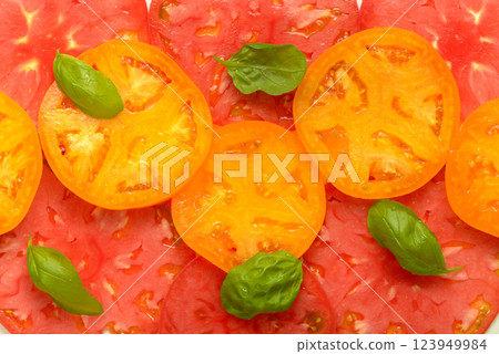 fresh mix tomato slices background and basil 123949984