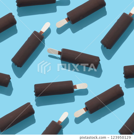 trendy seamless pattern of chocolate popsicle with ice cream and hard shadow on blue background, creative decoration of summer concept 123950129