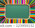 wreath of multicolored pencils on green chalkboard background, top view, copy space, back to school concept 123950132