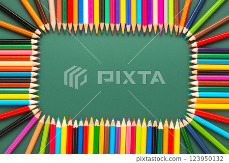 wreath of multicolored pencils on green chalkboard background, top view, copy space, back to school concept wreath of multicolored pencils on green chalkboard background, top view, copy space, back to school concept 123950132