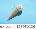 top view of ice cream cone and strewed sprinkles on blue with hard shadow, minimal  summer concept 123950136