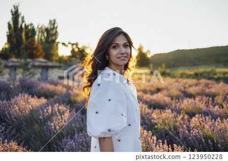 Young white woman among lavender bushes 123950228