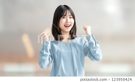 Woman/businesswoman doing a fist pump Woman/businesswoman doing a fist pump 123950424