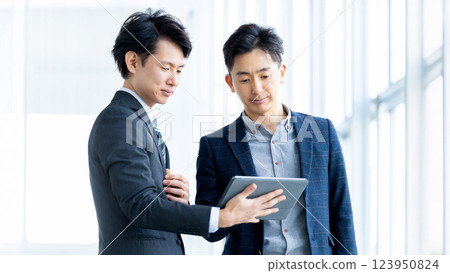 Two male businessmen having a meeting 123950824