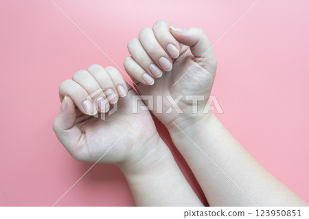 Female hands with short natural nails Female hands with short natural nails 123950851