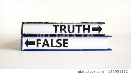 Truth or false symbol. Concept word Truth or False on beautiful books. Beautiful white table white background. Business and truth or false concept. Copy space. 123951112