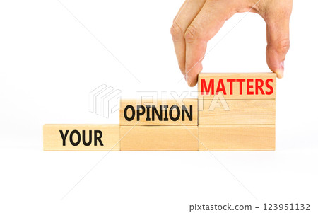 Your opinion matters symbol. Concept words Your opinion matters on beautiful wooden blocks. Beautiful white table white background. Businessman hand. Business your opinion matters concept. Copy space. 123951132