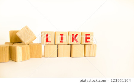 Like symbol. Concept word Like on beautiful wooden blocks. Beautiful white table white background. Business, lifestyle, support and like concept. Copy space. 123951164