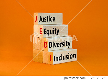 Justice equity diversity inclusion symbol. Concept words JEDI Justice Equity Diversity Inclusion on blocks. Beautiful orange background. Business justice equity diversity inclusion concept. Copy space 123951175
