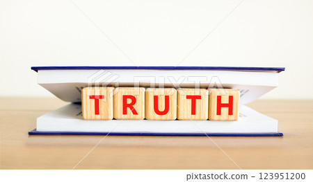 Truth symbol. Concept word Truth on beautiful wooden blocks in book. Beautiful wooden table white background. Business lifestyle truth concept. Copy space. Truth symbol. Concept word Truth on beautiful wooden blocks in book. Beautiful wooden table white background. Business lifestyle truth concept. Copy space. 123951200