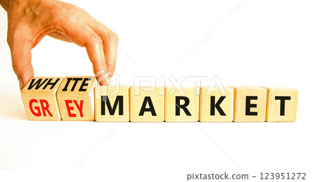 Grey or white market symbol. Concept words Grey market or White market on beautiful wooden blocks. Beautiful white background. Businessman hand. Business grey or white market concept. Copy space. Grey or white market symbol. Concept words Grey market or White market on beautiful wooden blocks. Beautiful white background. Businessman hand. Business grey or white market concept. Copy space. 123951272