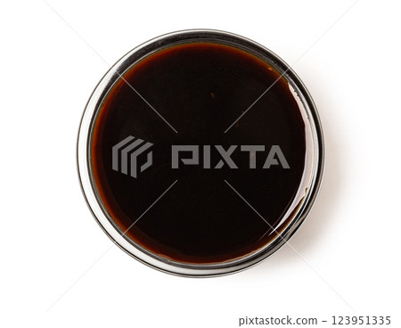 Small glass bowl with soy sauce or balsamic vinegar on white background 123951335