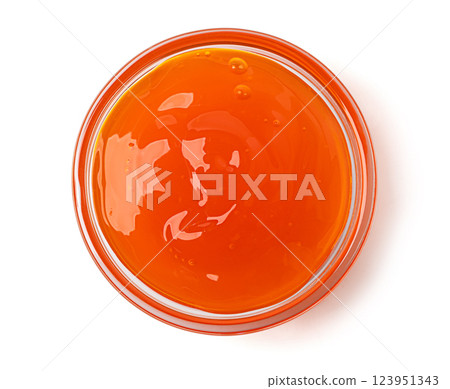 Apricot jam in a glass bowl on white background 123951343