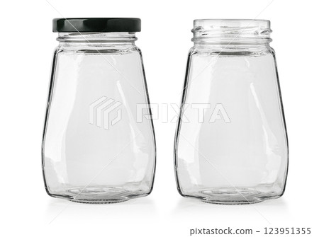 Two empty glass jars showing open and closed with black cap 123951355