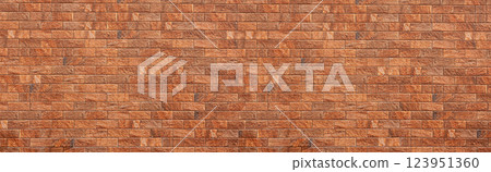 Modern brick wall forming an orange textured background 123951360