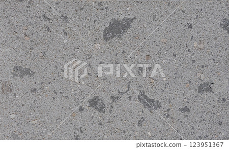 Gray concrete wall showing fine gravel and dark spots texture background 123951367