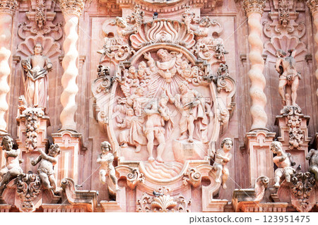 Detail of the facade of the beautiful historic Church of Santa Prisca built between 1751 and 1759 located on the east side of the main plaza of Taxco de Alarcon. 123951475