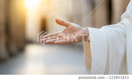 Hand of Jesus reaching out with light in spiritual scene, copy space background 123951813