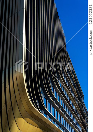 Masarycka office and retail building by Zaha Hadid Architects with golden facade on March 5, 2025 in Prague, Czech Republic. 123952321