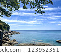 Tropical Beach Paradise with Crystal Clear Water and Rocky Shoreline in Phuket, Thailand 123952351