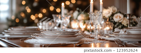 Elegant vintage table decor with china plates, crystal glassware, silver cutlery, and soft golden candlelight, evoking a nostalgic and timeless atmosphere for a sophisticated setting, banner Elegant vintage table decor with china plates, crystal glassware, silver cutlery, and soft golden candlelight, evoking a nostalgic and timeless atmosphere for a sophisticated setting, banner 123952624