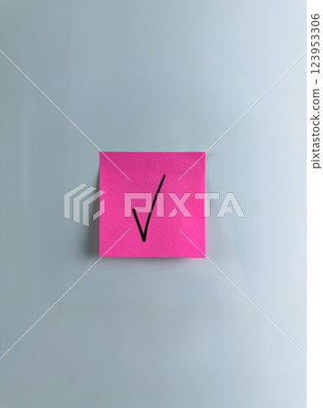 Vertical photo of check mark on sticky note to indicate your choice Vertical photo of check mark on sticky note to indicate your choice 123953306